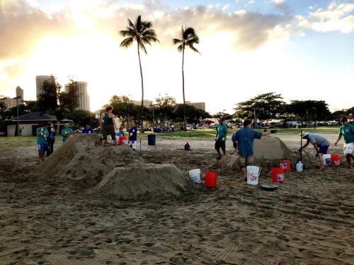 At Ala Moana Beach Park, Alex & Nick prepare to make sand sculptures with the Sand Guys!