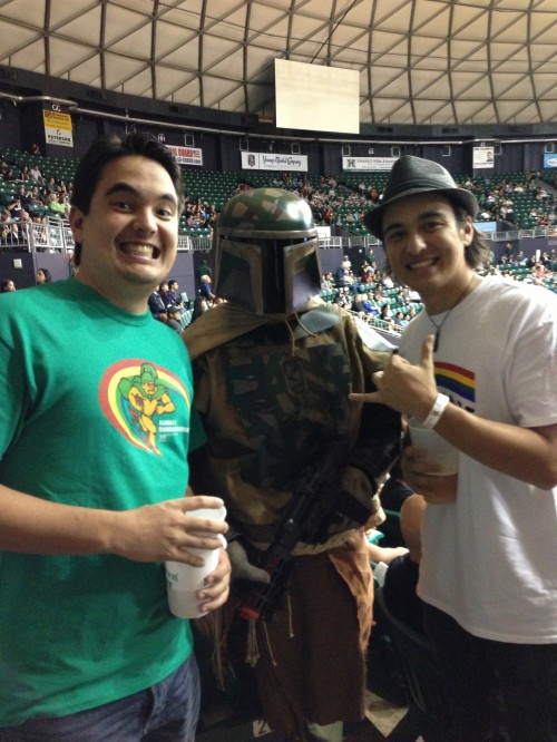 After singing the national anthem, Alex & Nick pose with "Boba Fett," a character from the movie "Star Wars."